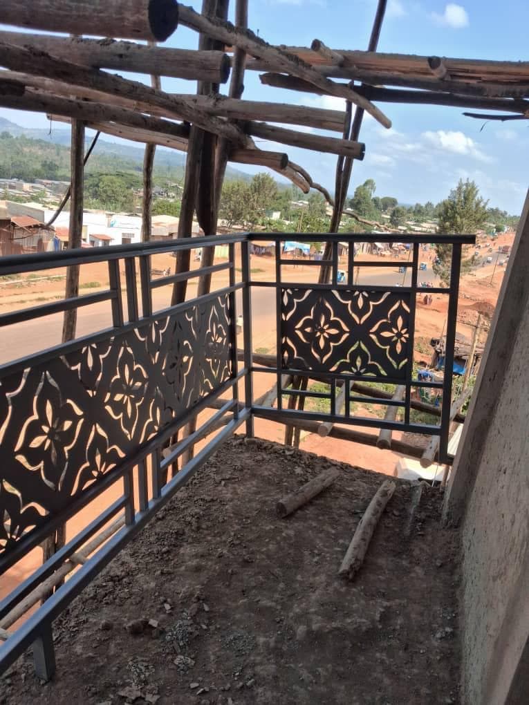 Decorative metal balcony railing looking out over the town